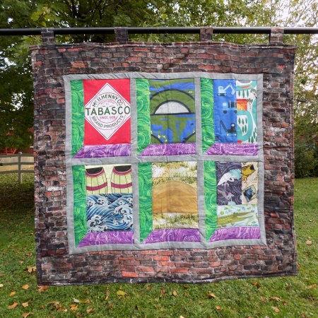 Photo of TABASCO quilt hanging outdoors