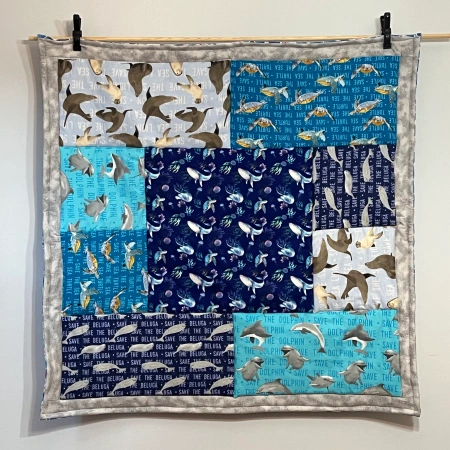 Hanging quilt with ocean-themed fabrics