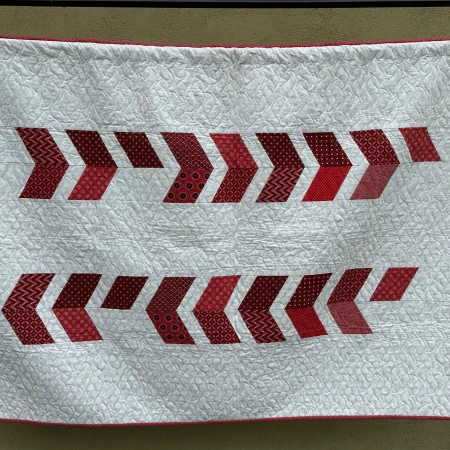 Hanging red and white quilt