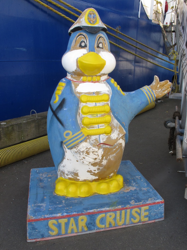 damaged penguin statue